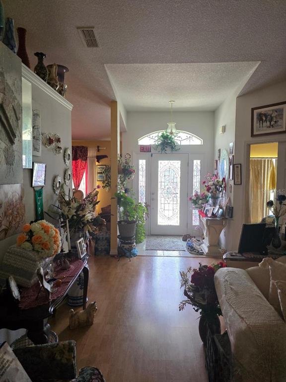 4671 Southwest 100th Lane Ocala, FL 34476 - Photo 8 of 8 a living room with furniture and wooden floor