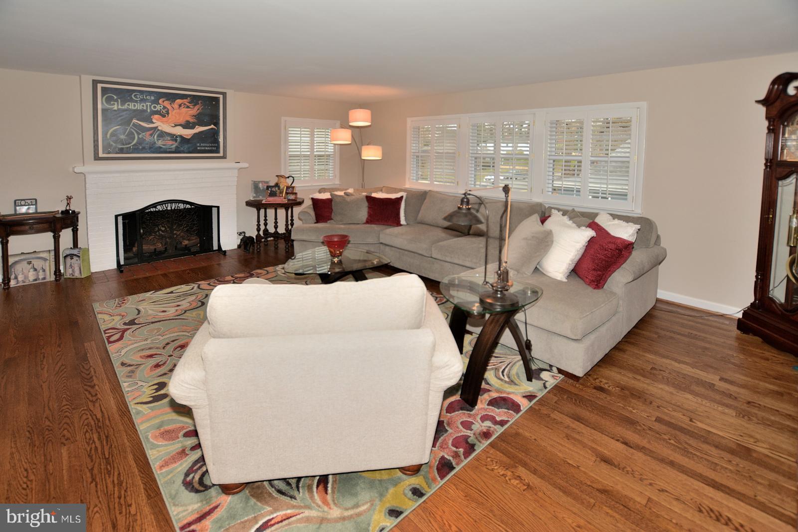 1129 Cameron Road Alexandria, VA 22308 - Photo 3 of 37 Sun-Filled Living Room with Gas Fireplace