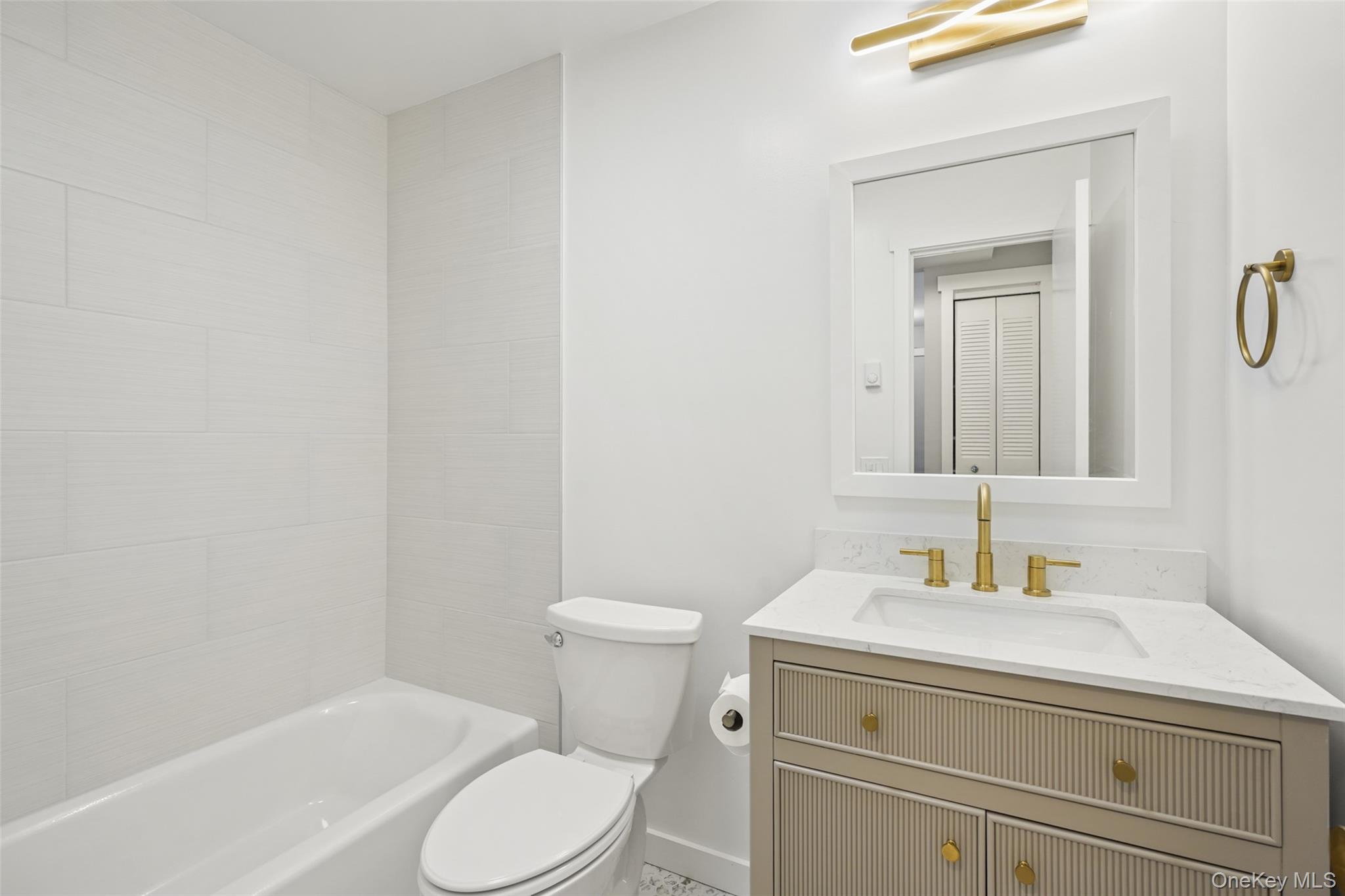 9 C Kings Court, Unit C Mohegan Lake, NY 10547 - Photo 15 of 31 a bathroom with a sink toilet and vanity