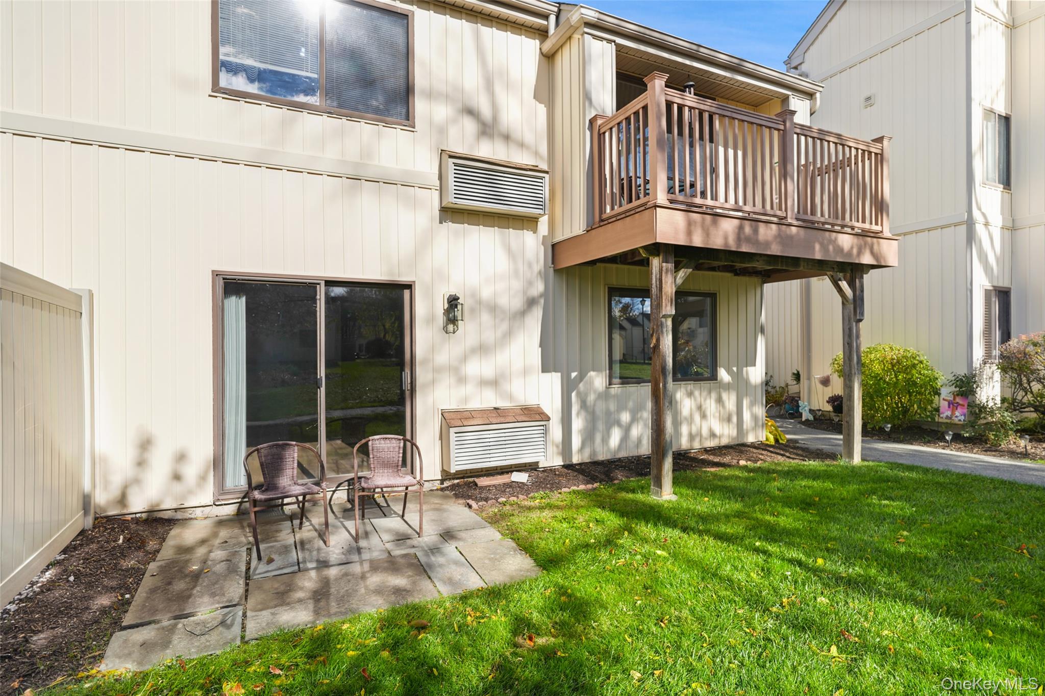9 C Kings Court, Unit C Mohegan Lake, NY 10547 - Photo 18 of 31 a view of a chair and table in backyard of the house