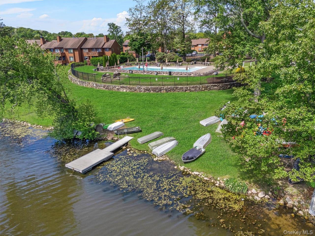9 C Kings Court, Unit C Mohegan Lake, NY 10547 - Photo 21 of 31 a view of a garden with a lake view