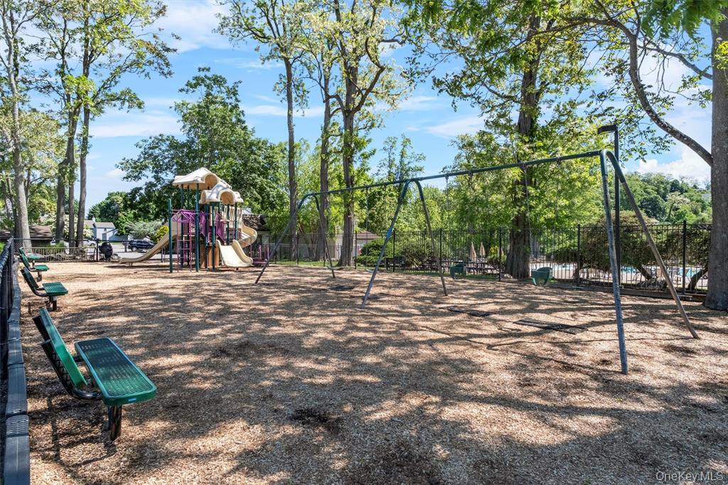 9 C Kings Court, Unit C Mohegan Lake, NY 10547 - Photo 25 of 31 a view of outdoor space with playground and green space