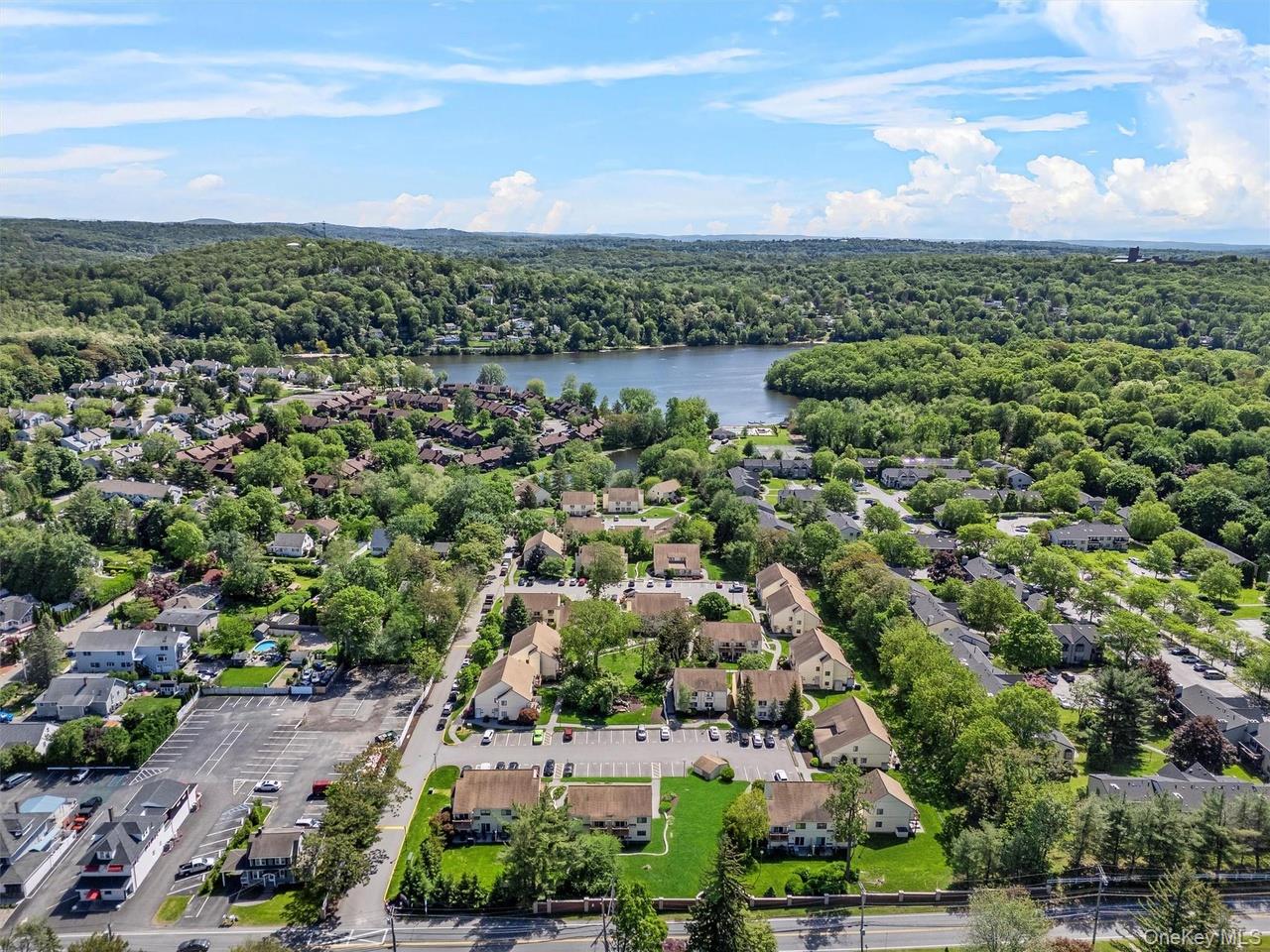 9 C Kings Court, Unit C Mohegan Lake, NY 10547 - Photo 29 of 31 an aerial view of residential houses with outdoor space and trees