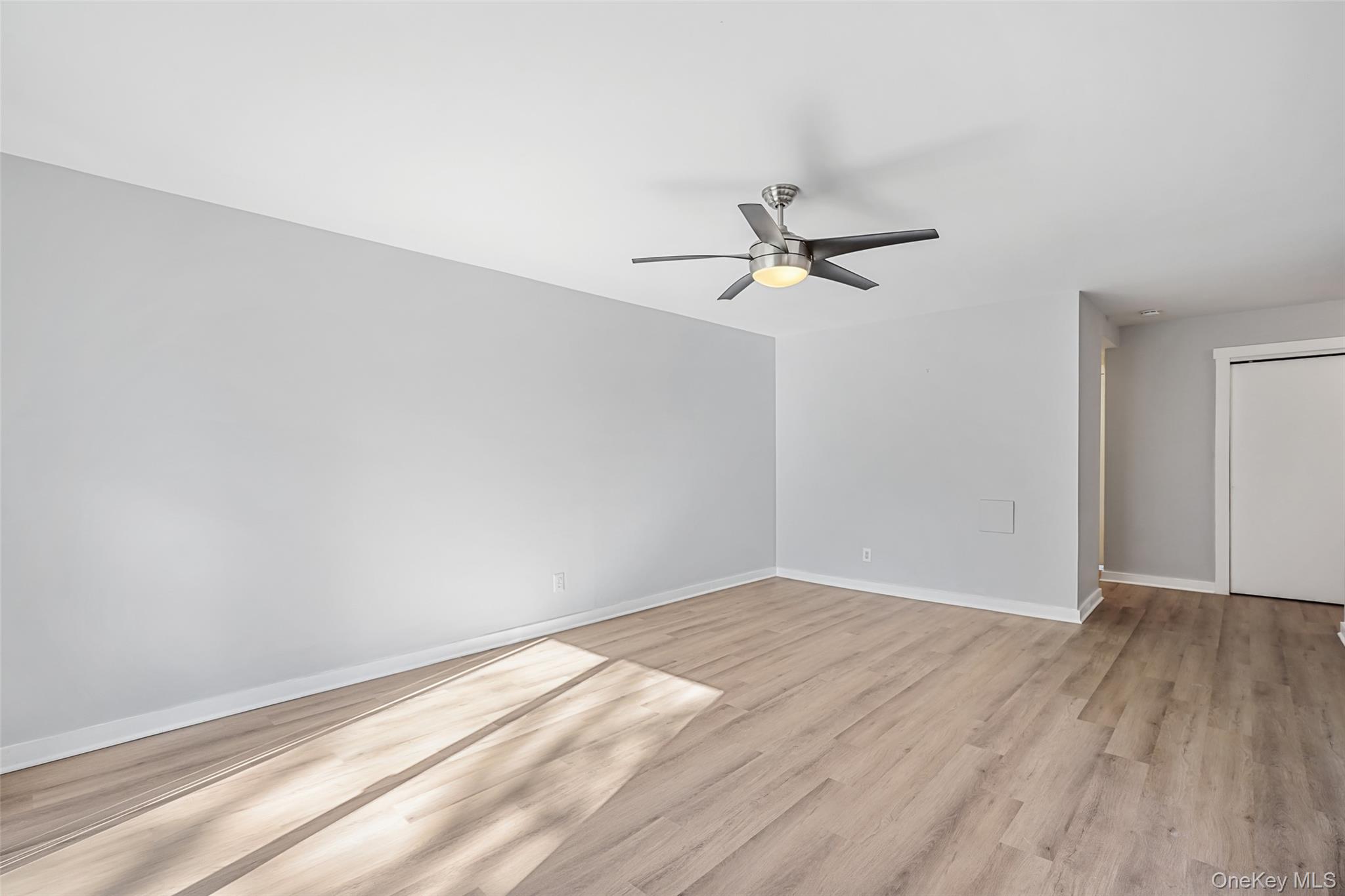 9 C Kings Court, Unit C Mohegan Lake, NY 10547 - Photo 5 of 31 wooden floor in an empty room