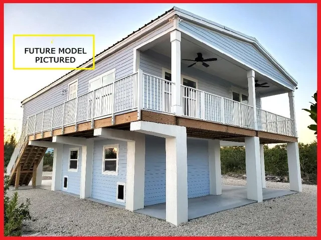 a view of lake with boats and trees