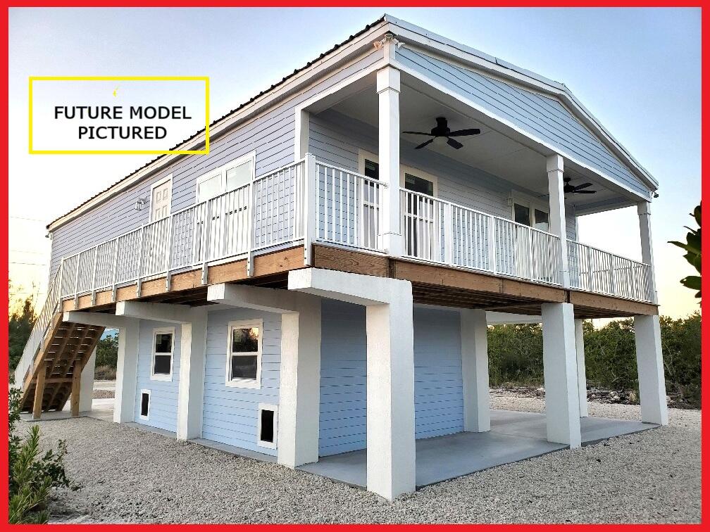 231 Pelican Lane Big Pine Key, FL 33043 - Photo 3 of 11 a view of a house with a small entryway