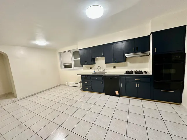 a room with a cabinets and a wooden floor