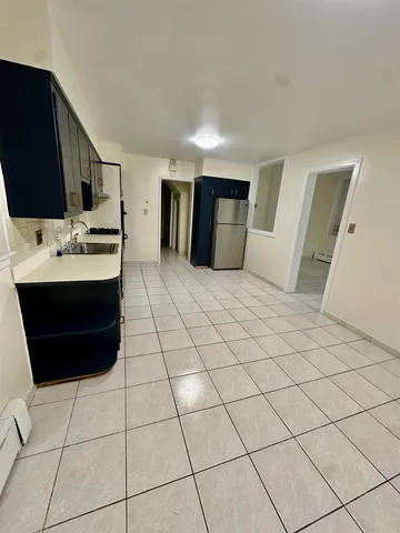 a living room with a table and chairs