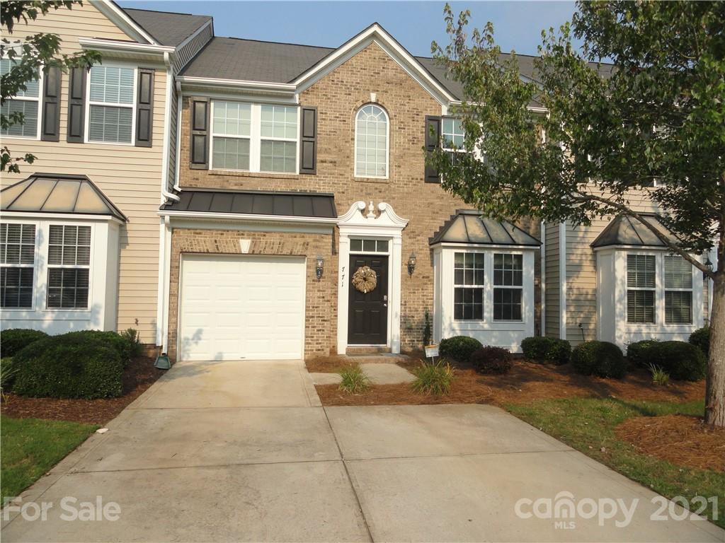 771 Prospect Lane, Unit 33 Fort Mill, SC 29708 - Photo 1 of 23 a front view of a house with a garden