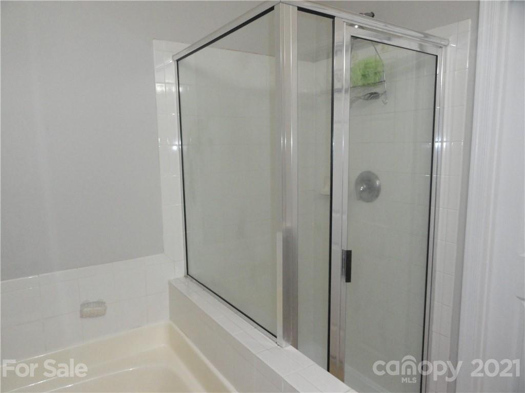 771 Prospect Lane, Unit 33 Fort Mill, SC 29708 - Photo 14 of 23 a bathroom with a shower and a bath tub