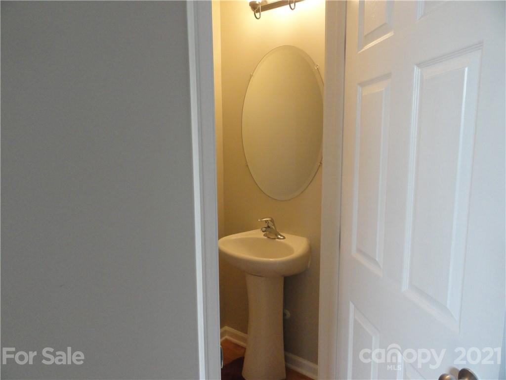 771 Prospect Lane, Unit 33 Fort Mill, SC 29708 - Photo 3 of 23 a bathroom with a sink mirror and toilet