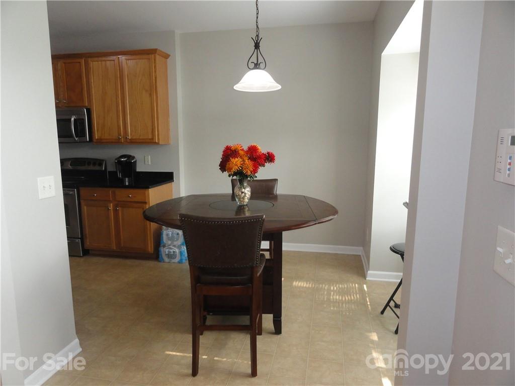 771 Prospect Lane, Unit 33 Fort Mill, SC 29708 - Photo 4 of 23 a dining room with furniture and window