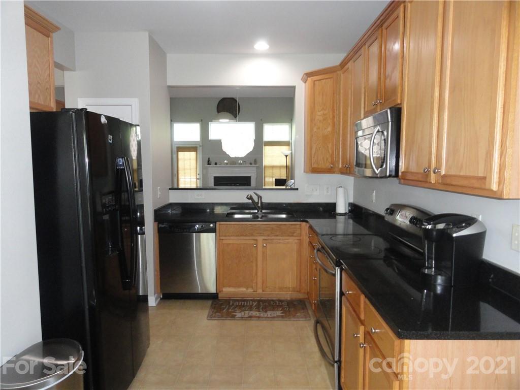 771 Prospect Lane, Unit 33 Fort Mill, SC 29708 - Photo 5 of 23 a kitchen with a refrigerator and a sink