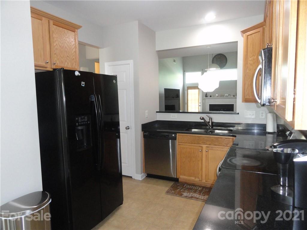 771 Prospect Lane, Unit 33 Fort Mill, SC 29708 - Photo 6 of 23 a kitchen with stainless steel appliances granite countertop a refrigerator and a sink