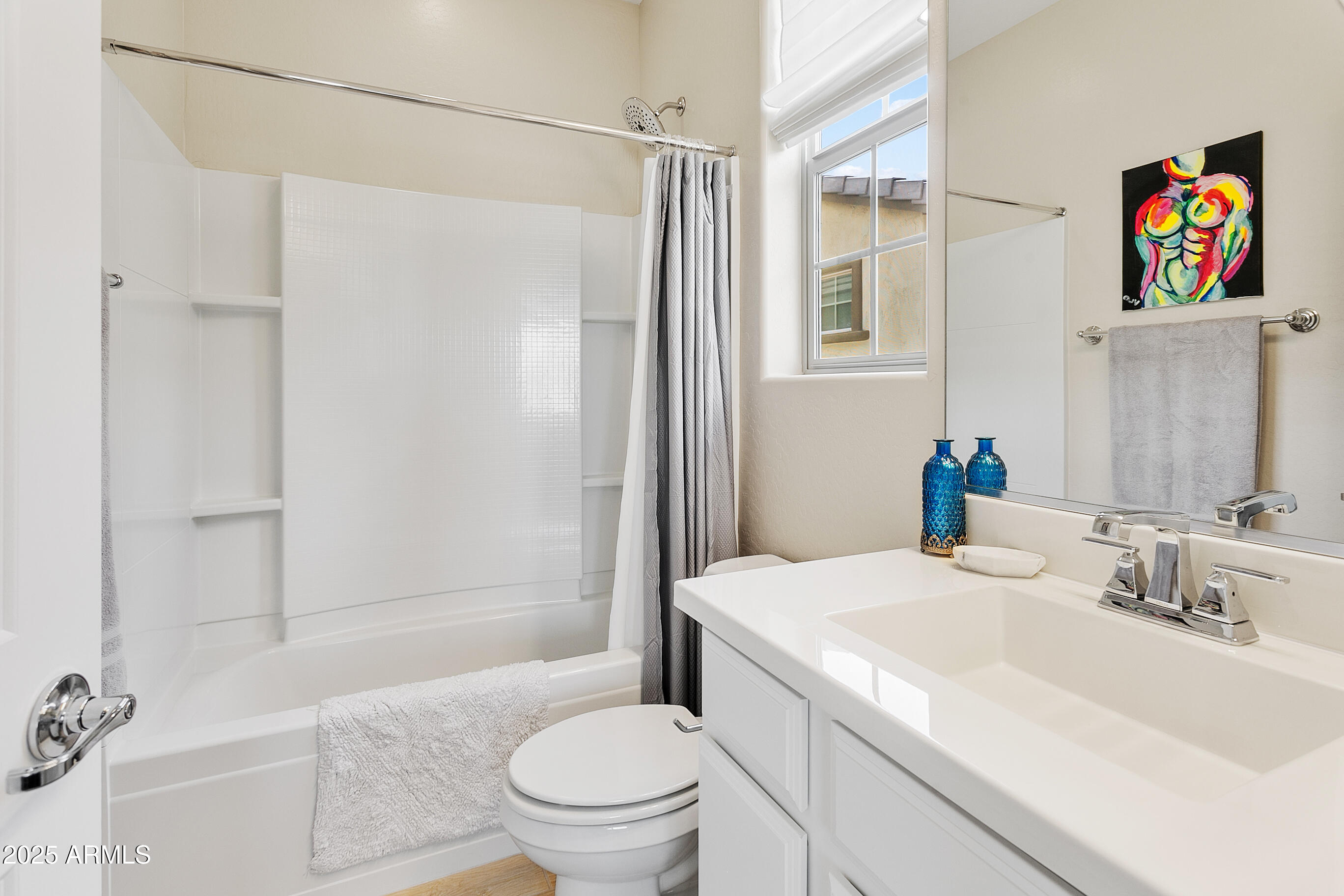 1661 East Hampton Lane Gilbert, AZ 85295 - Photo 21 of 31 a bathroom with a sink a toilet and shower