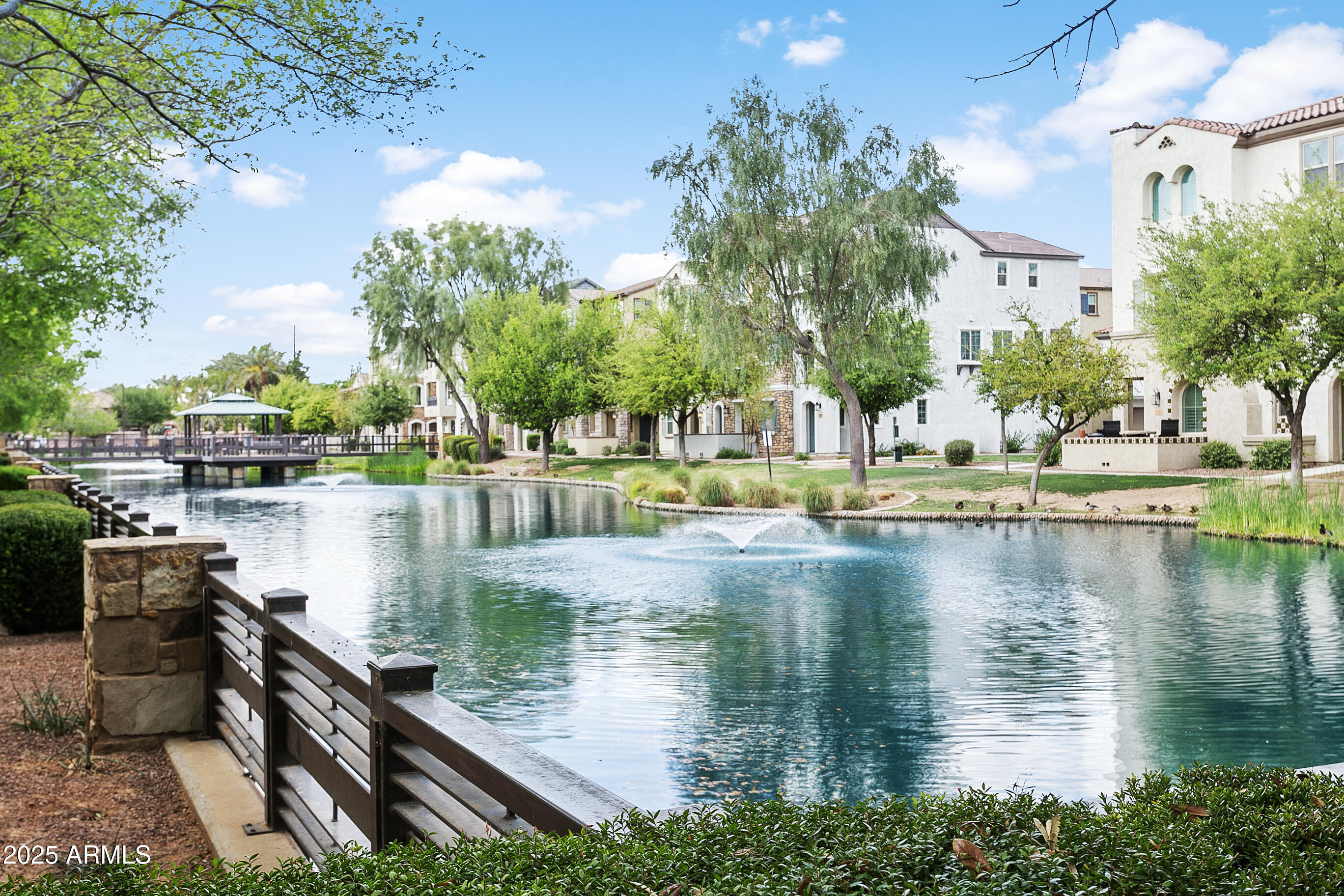 1661 East Hampton Lane Gilbert, AZ 85295 - Photo 25 of 31 a view of a lake with a house