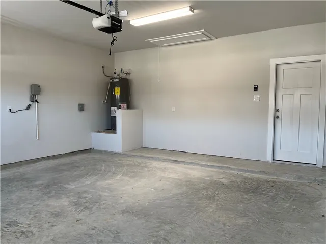 a view of a big room with a chandelier fan