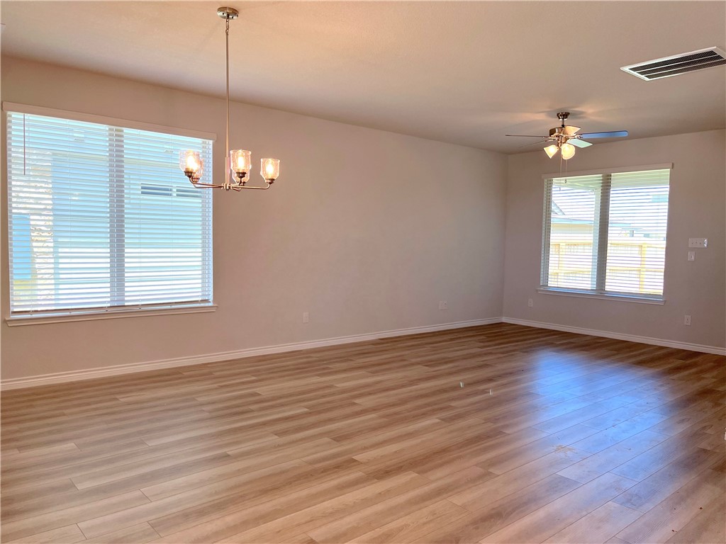 803 Double Mountain Road College Station, TX 77845 - Photo 5 of 17 a view of an empty room with wooden floor and a window