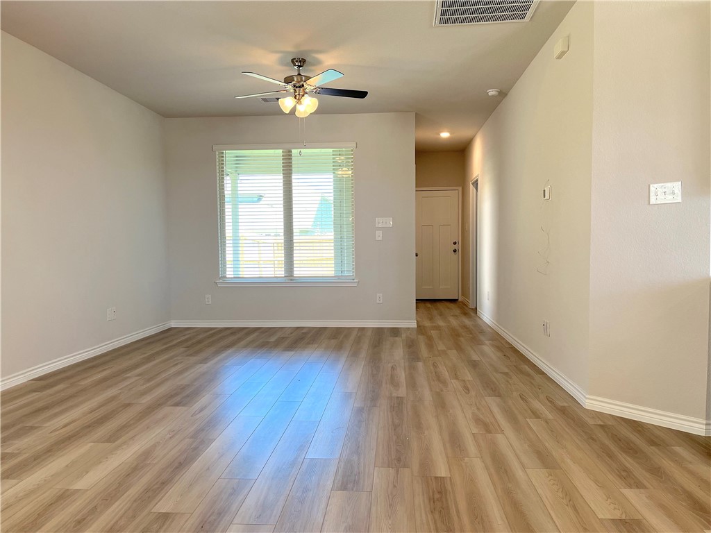803 Double Mountain Road College Station, TX 77845 - Photo 6 of 17 a view of an empty room with a window and wooden floor