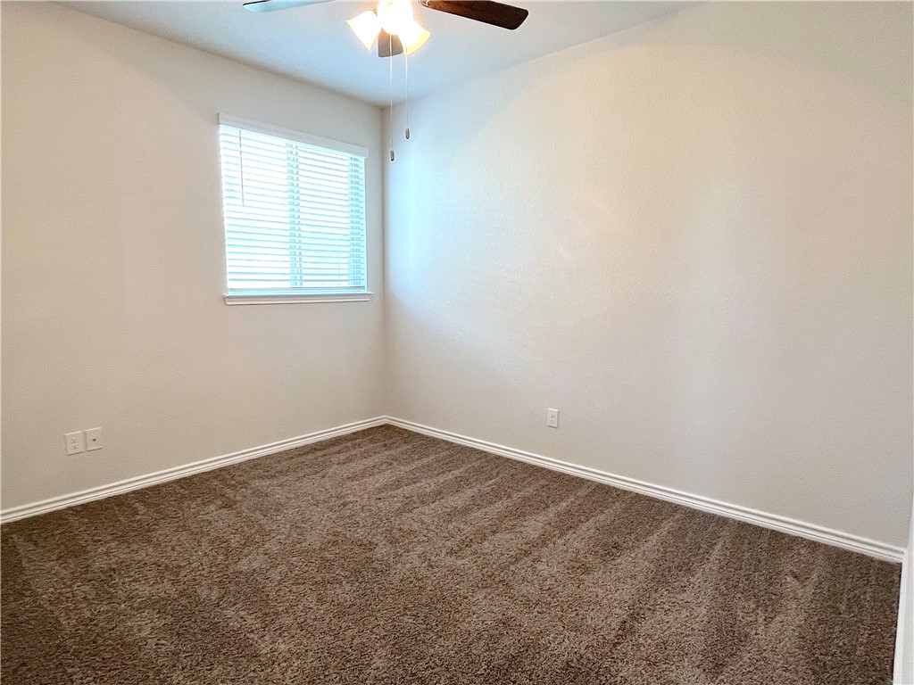 803 Double Mountain Road College Station, TX 77845 - Photo 10 of 17 an empty room with a window