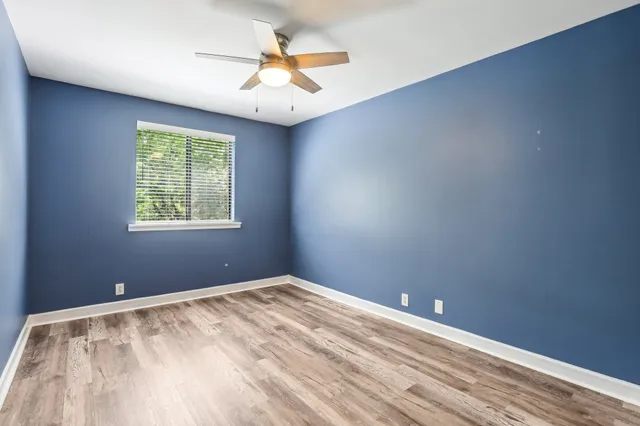 a view of a room with a ceiling fan