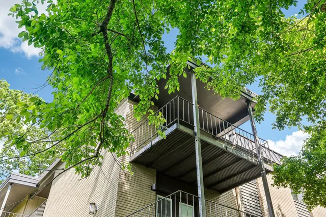 a swimming pool with outdoor seating and yard