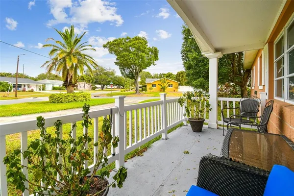 a living room with furniture window and wooden floor