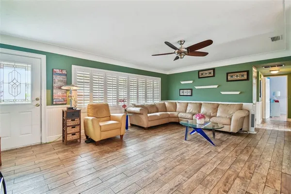 a dining room with furniture and window