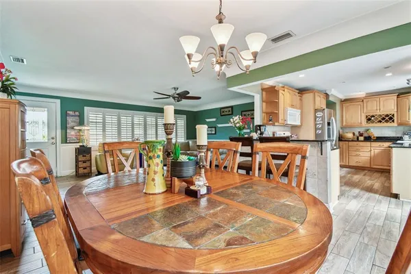 a dining room with furniture and window