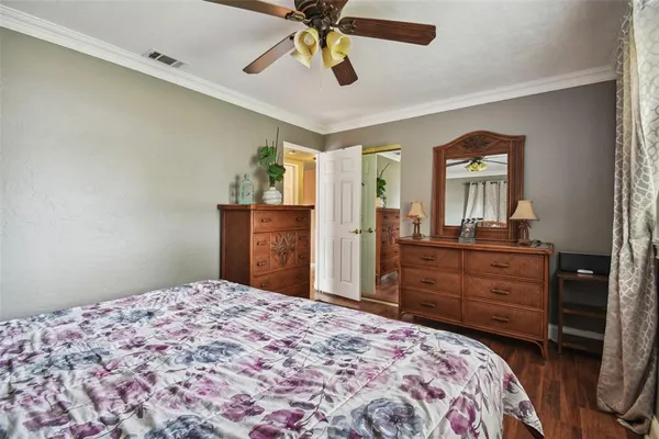 a bathroom with a sink mirror and a window