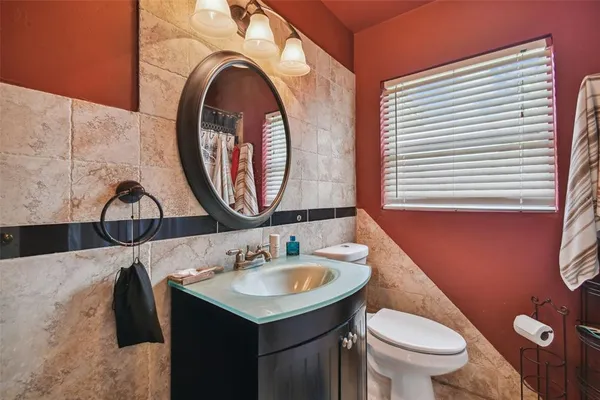 a view of a workspace with furniture and wooden floor