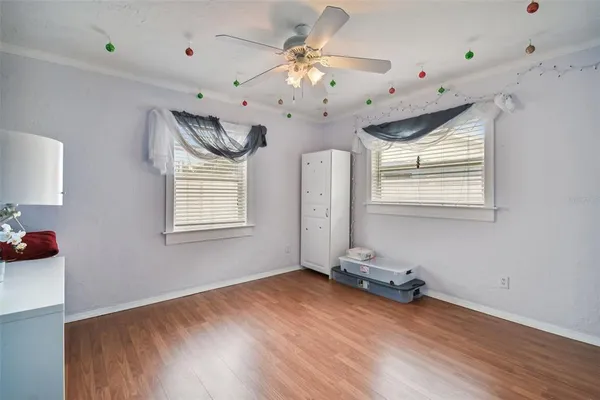a room with a couch and a dining table