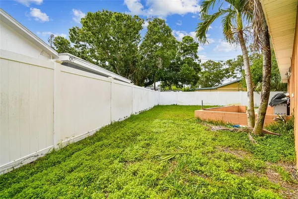 an aerial view of residential houses with outdoor space and swimming pool