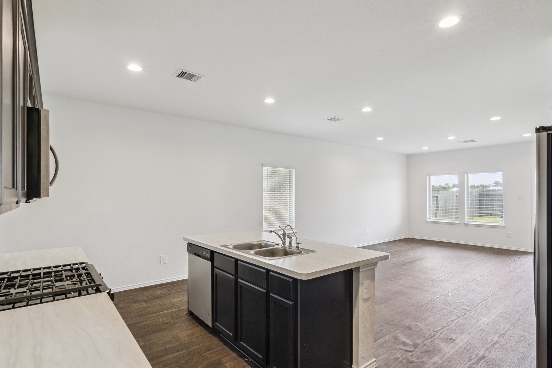 22431 Gilded Peak Lane Spring, TX 77373 - Photo 7 of 18 Open concept kitchen and living room