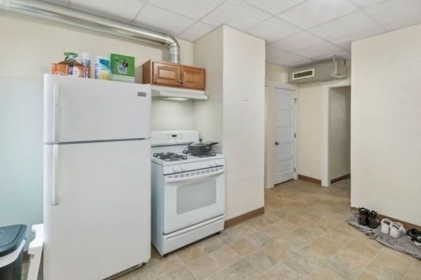 171 Mechanic Street Southbridge, MA 01550 - Photo 18 of 37 a white refrigerator freezer sitting inside of a kitchen