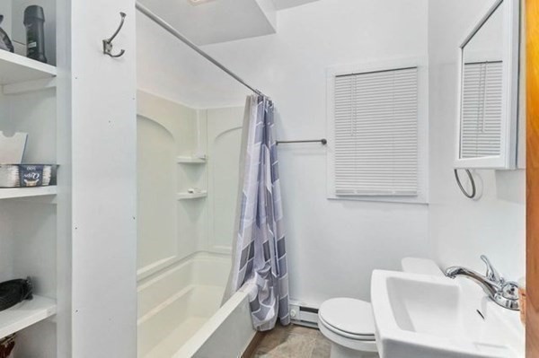 171 Mechanic Street Southbridge, MA 01550 - Photo 19 of 37 a bathroom with a sink a toilet and shower