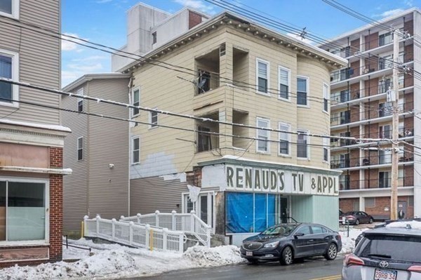171 Mechanic Street Southbridge, MA 01550 - Photo 22 of 37 a front view of a building with parking space