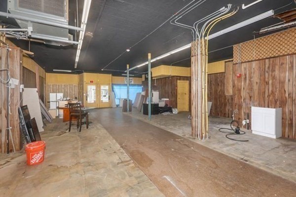 171 Mechanic Street Southbridge, MA 01550 - Photo 27 of 37 a view of an empty room with wooden floor and windows