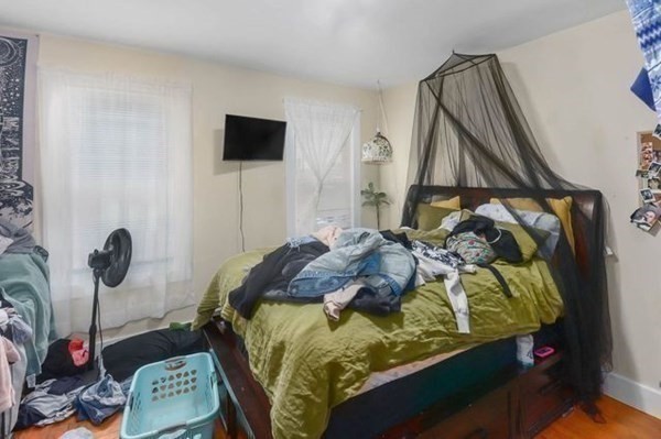 171 Mechanic Street Southbridge, MA 01550 - Photo 10 of 37 a bed sitting in a bedroom next to a window