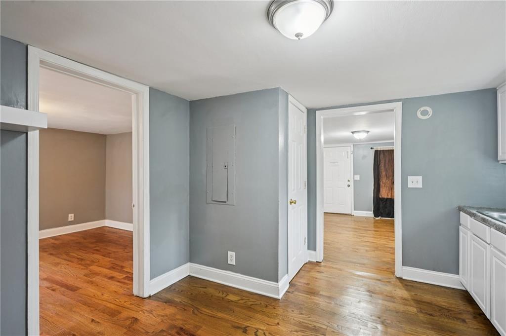 5160 Avery Street Southwest Covington, GA 30014 - Photo 13 of 23 a view of a room with wooden floor and bathroom
