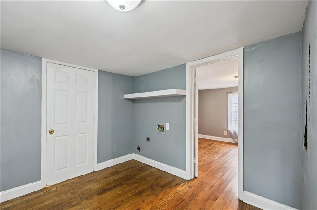 5160 Avery Street Southwest Covington, GA 30014 - Photo 15 of 23 wooden floor in an empty room