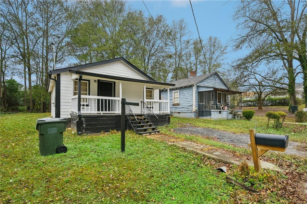 5160 Avery Street Southwest Covington, GA 30014 - Photo 2 of 23 a backyard of a house with table and chairs