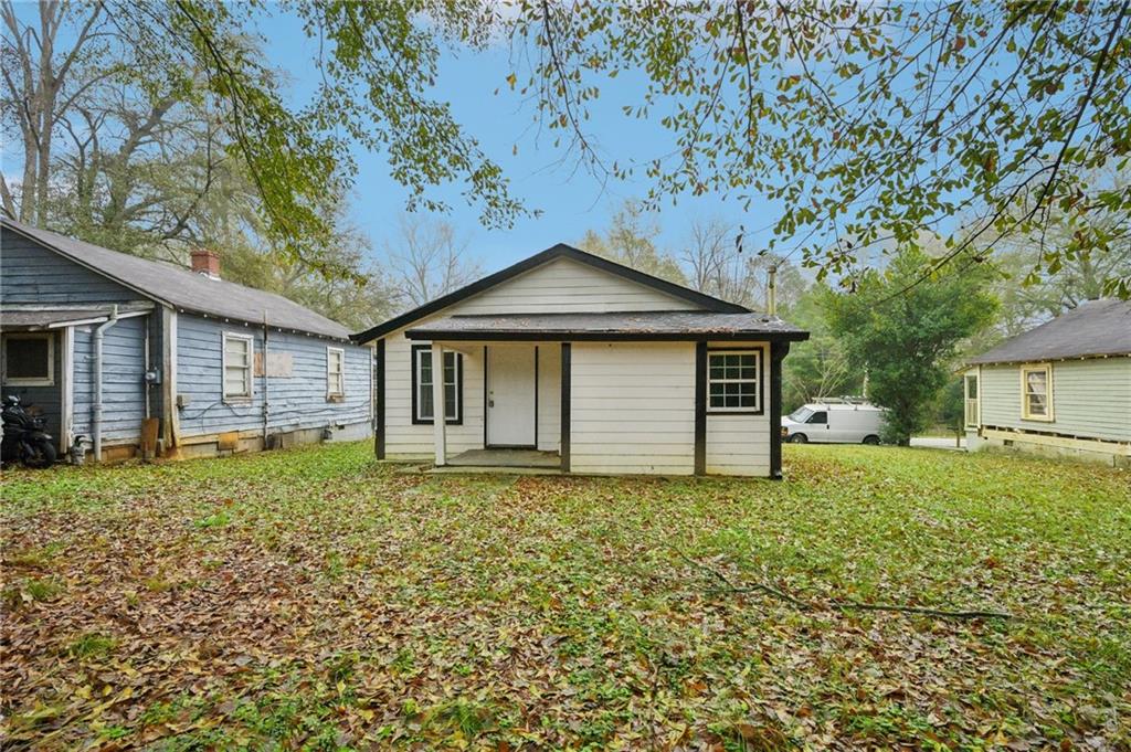 5160 Avery Street Southwest Covington, GA 30014 - Photo 21 of 23 a house with trees in the background