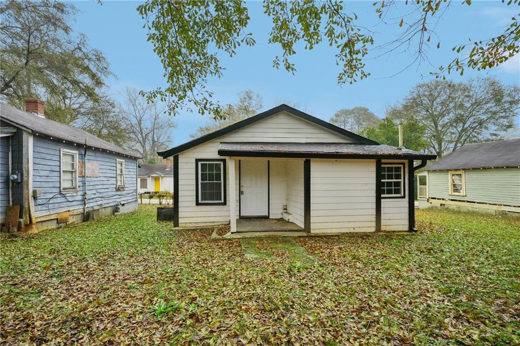 5160 Avery Street Southwest Covington, GA 30014 - Photo 23 of 23 a front view of a house with garden