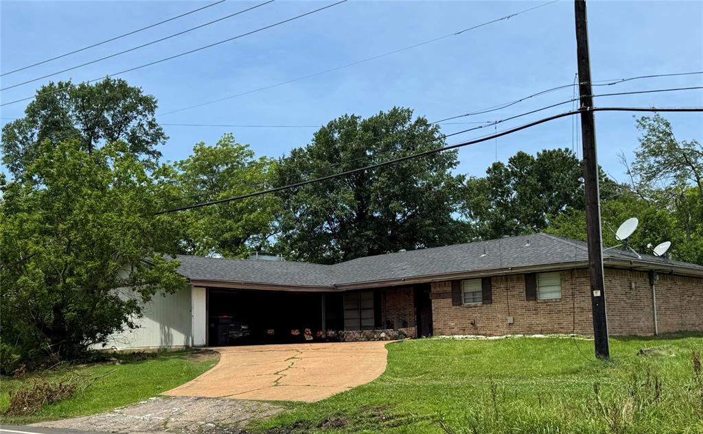 4515 Southeast Loop 286 Paris, TX 75460 - Photo 22 of 37 a view of a house with a yard