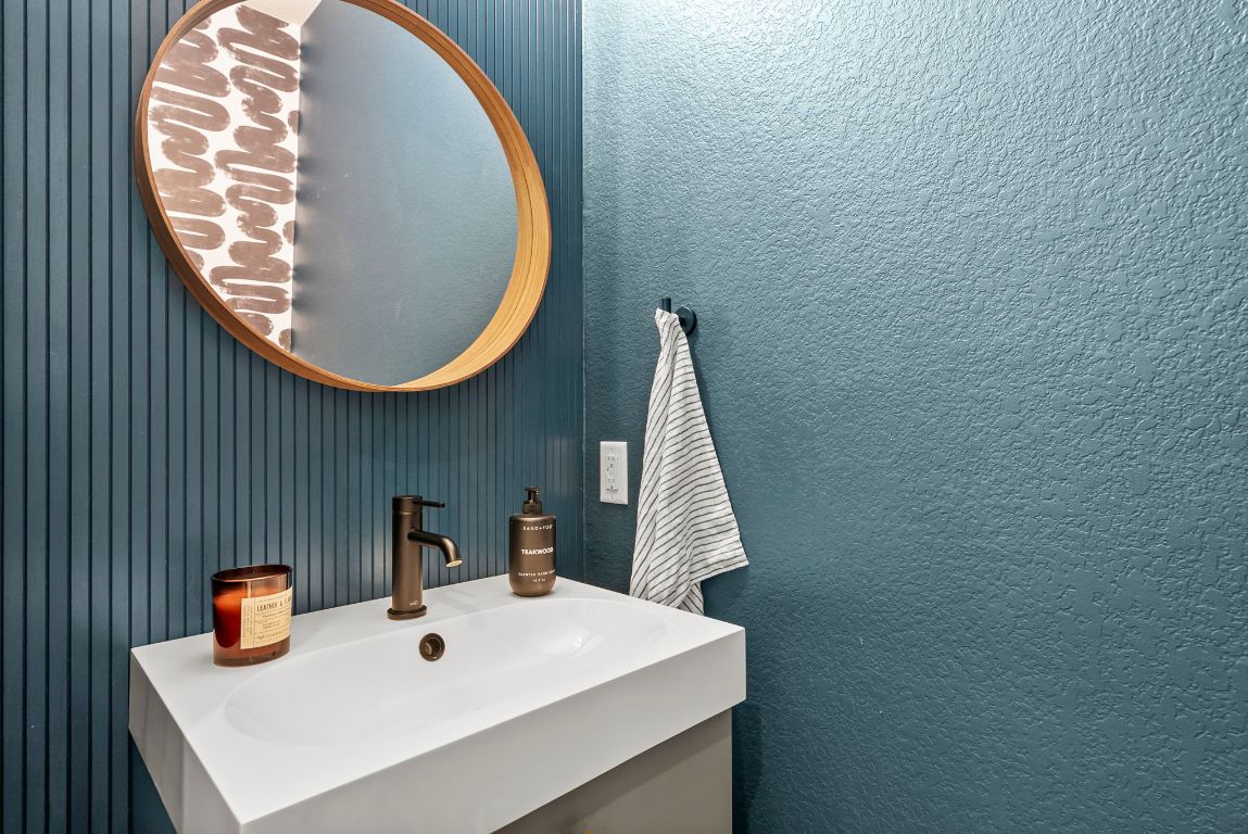 1912 Wildfire Leander, TX 78641 - Photo 18 of 40 a bathroom with a sink and a mirror