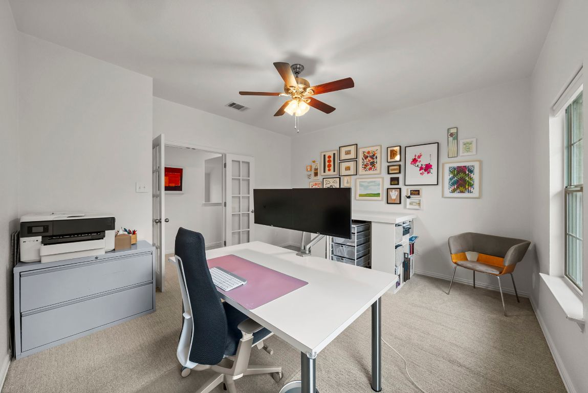 1912 Wildfire Leander, TX 78641 - Photo 20 of 40 a workspace with furniture and a chandelier