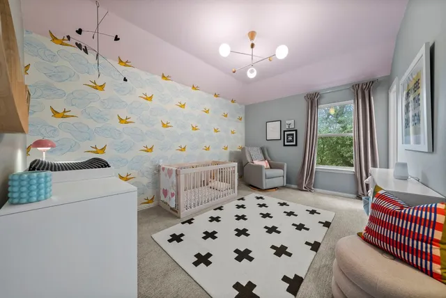 a bathroom with a granite countertop toilet sink and mirror