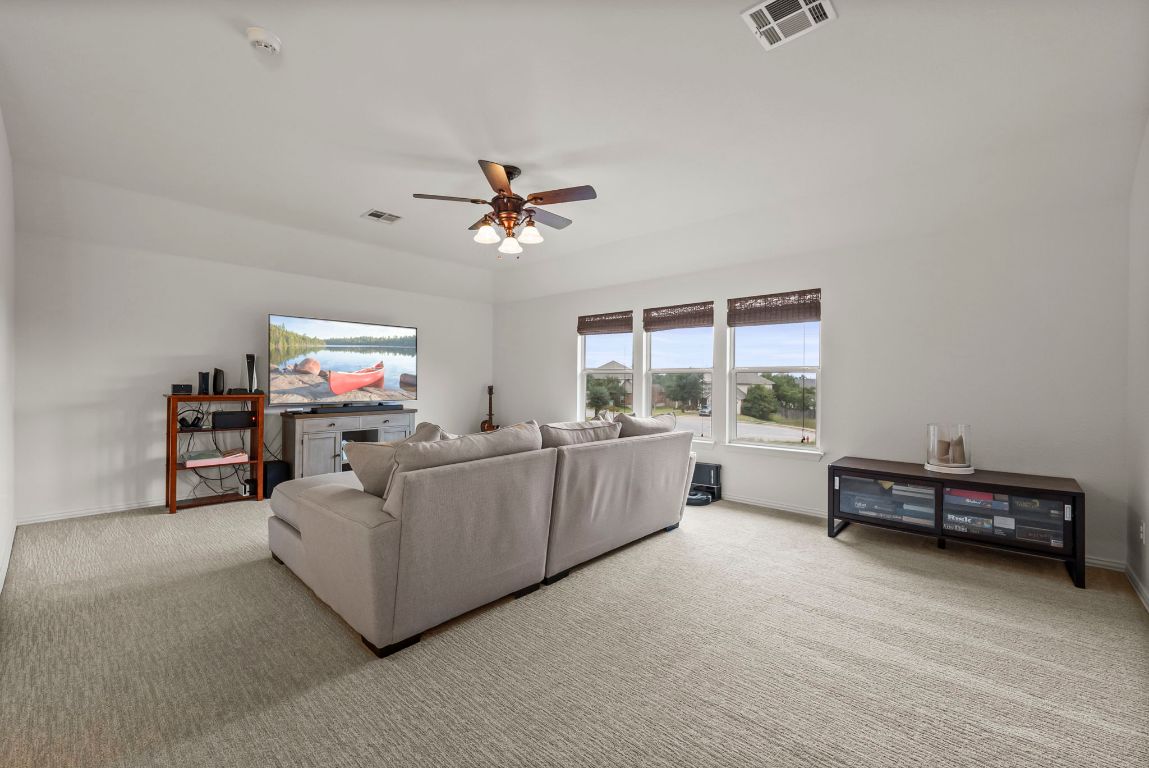 1912 Wildfire Leander, TX 78641 - Photo 26 of 40 a living room with furniture and a flat screen tv