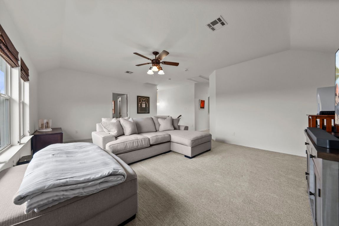 1912 Wildfire Leander, TX 78641 - Photo 27 of 40 a living room with furniture and a ceiling fan
